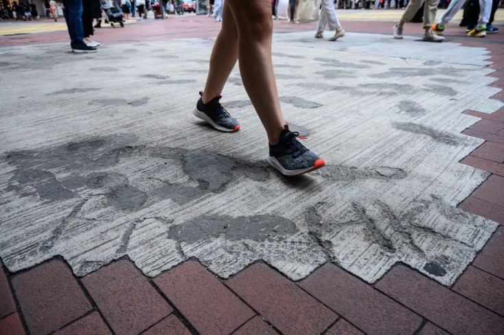 Throughout the city concrete remains daubed with anti-government slogans before it had time to dry