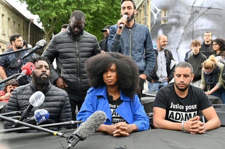 Assa Traore (centre), the sister of Adama Traore, who died in a French police arrest in 2016, at a press conference after a mural to her brother and George Floyd was unveiled in Paris Tuesday
