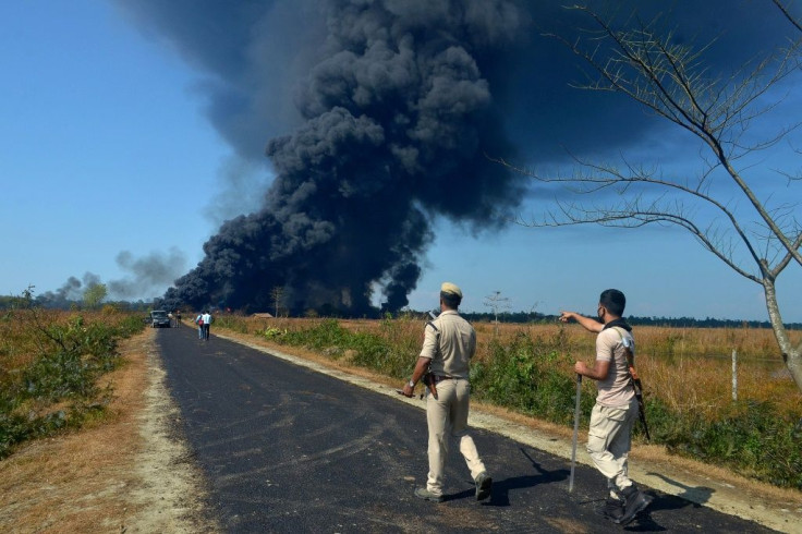 Police ask people to move to a safer place following the explosion in India's Assam state