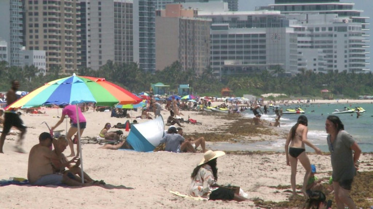 Miami's beaches in South Florida opened for the first time in three months Wednesday, an emotional moment for many residents whose leisure and financial well-being are intrinsically tied to the sandy shores, which were closed due to coronavirus.