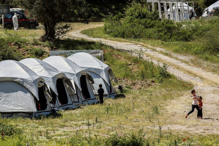 Tents have been set up in a migrant camp in Lesbos to conduct coronavirus tests