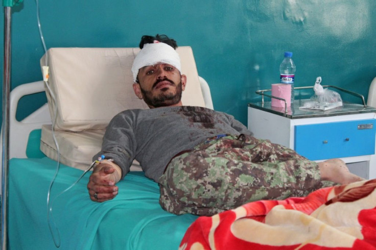 A wounded Afghan National Army soldier rests inside a hospital after an attack a base in Paktia province in May 2020