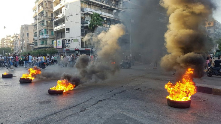Protesters burn tires as they demonstrate against dire economic conditions in Lebanon's northern city of Tripoli