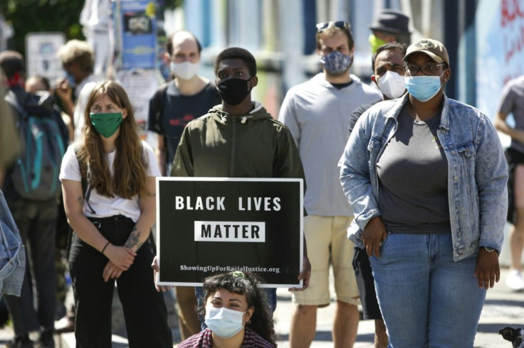 A crowd gathers to listen to speakers in Seattle's Capitol Hill Autonomous Zone (CHAZ)