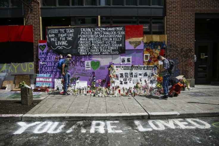 Demonstrators in Seattle's CHAZ area set up a shrine to the memory of the late George Floyd, whose death at the hands of a white Minneapolis police officer triggered the recent wave of protests