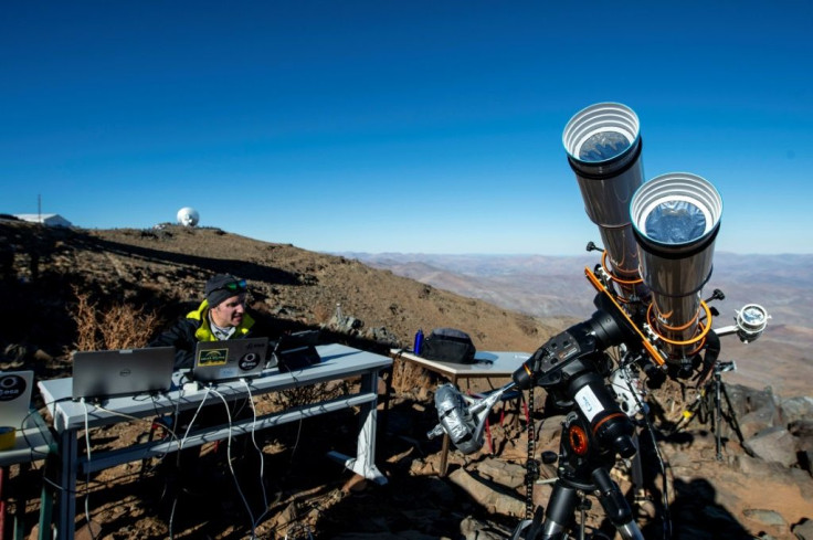 An astronomer prepares equipment ahead of a solar eclipse at the La Silla European Southern Observatory in Chile's Coquimbo region, on July 2, 2019