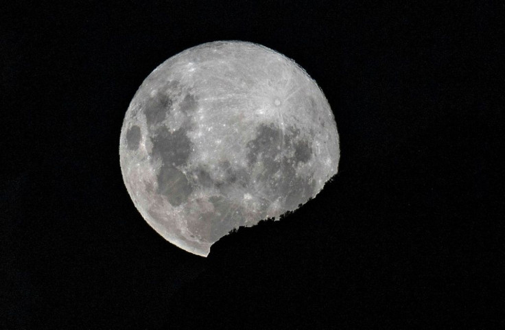 A supermoon -- when the moon reaches its closest position to the Earth -- rises over Santiago, on April 7, 2020