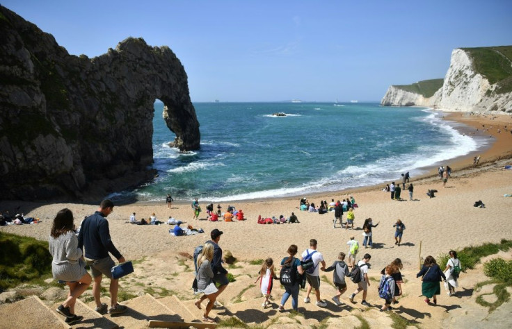 With many Britons looking to stay at home this year in the wake of the coronavirus media and travel firms have been talking up the merits of domestic destinations such as Durdle Door near West Lulworth on the south coast
