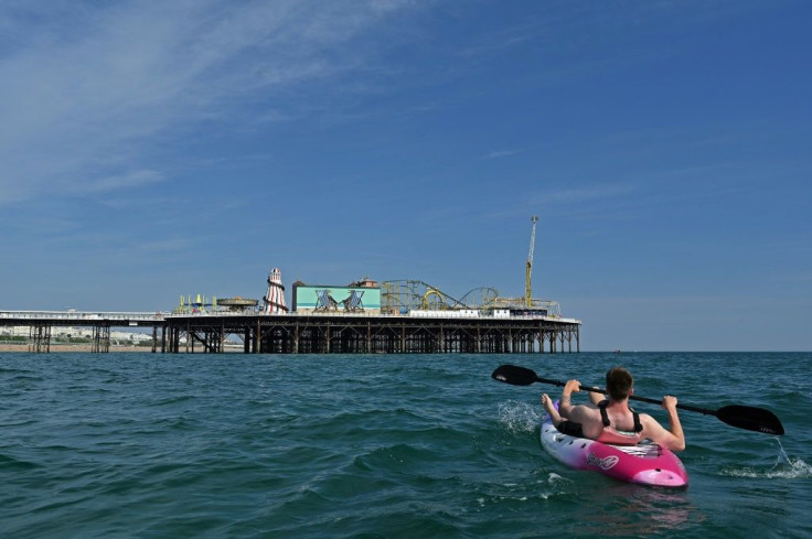 Simple pleasures such as a  paddle can keep some locals happy -- but British tourism authorities are fretting  the economy stands to lose billions in lost revenue from overseas visitors