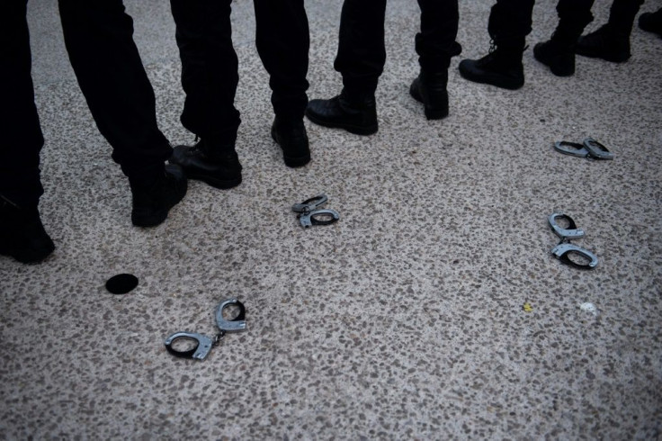 Officiers threw handcuffs on the ground in Marseille during a protest on Thursday