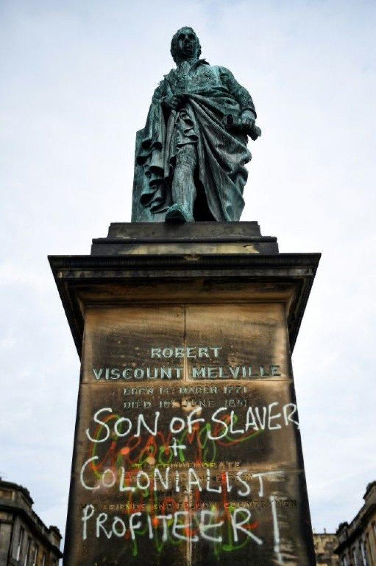 Graffiti covers a statue of Robert Dundas, 2nd Viscount Melville, in Edinburgh