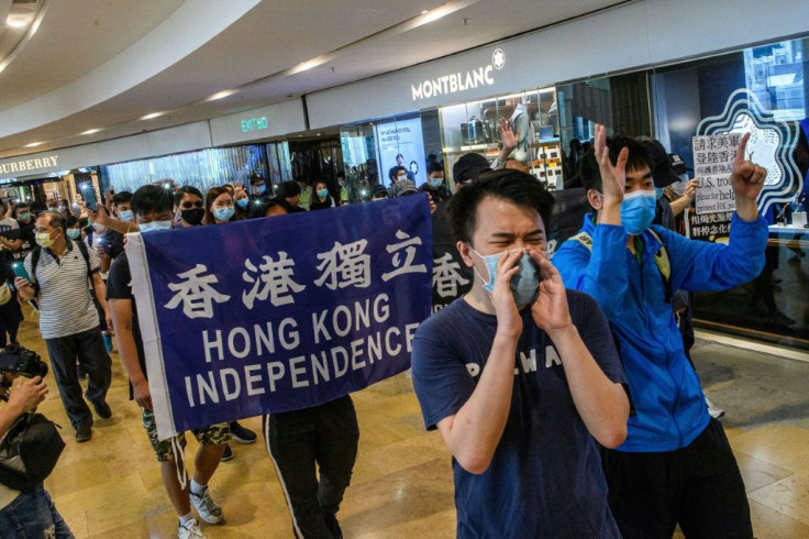 Pro-democracy protesters rally in a shopping mall in Hong Kong on June 12, 2020