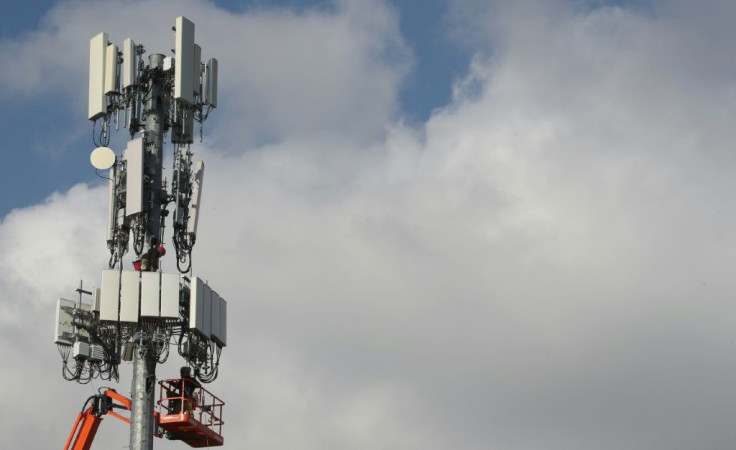 Workers installing a 5G antenna in Orem, Utah in November 2019