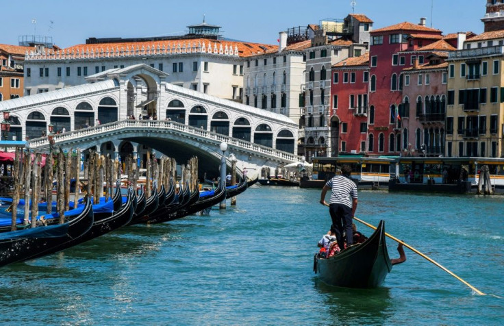 The gondoliers are back in action as tourists flock back to Venice