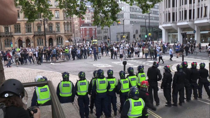 IMAGESThousands of people, gather at a far-right linked protest in London to 'guard' the statue of Winston Churchill as fears it will be vandalised grow. Some protesters clashed with police and were seen throwing projectiles at officers. The gathering was