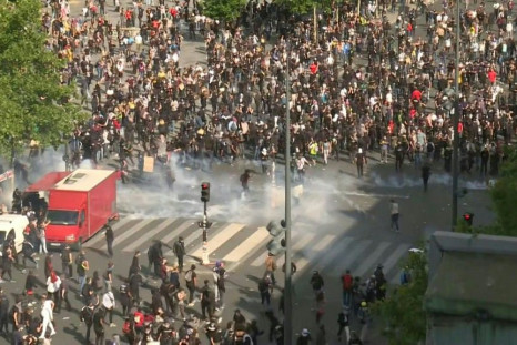 IMAGES Police fire tear gas and block an exit path during a protest against police brutality and racism in central Paris. Organisers of the rally attempted to keep people calm and "not provoke them", even after tear gas cannisters were fired into the larg