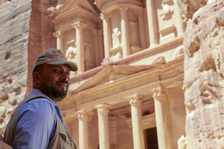 Nayef Hilalat, who guards the ancient archaeological site, poses in front of Al-Khazneh, one of Petra's most famous attractions and a location for Steven Spielberg's 1989 film Indiana Jones and the Last Crusade