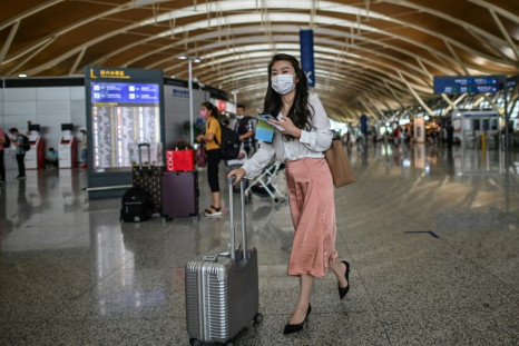 China's coronavirus travel ban is wreaking havoc among foreign companies and international schools, as executives, teachers and students are left stranded in their home countries