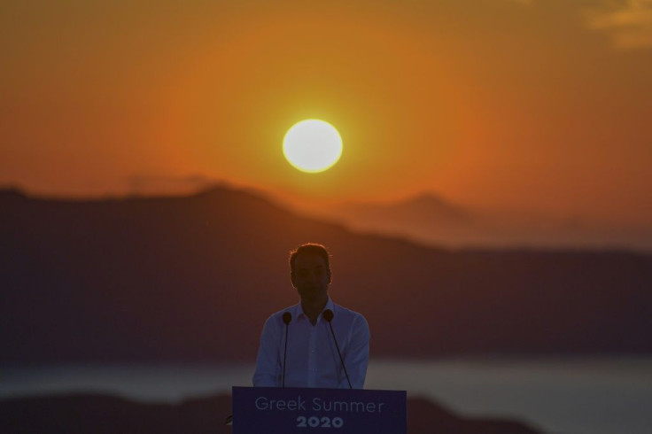 Greek Prime Minister Kyriakos Mitsotakis travelled to picturesque Santorini island on Saturday to open his country's tourism season