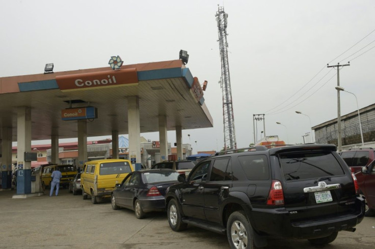 Motorists queue to buy petrol at a Lagos filling station