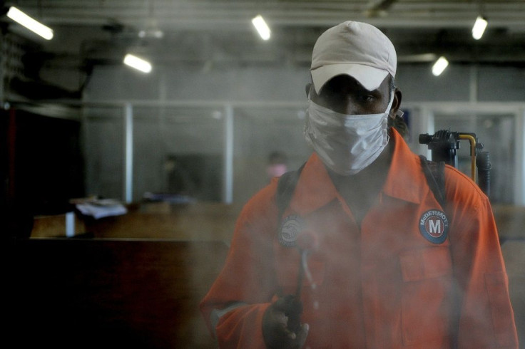 A health worker sprays disinfectant inside government offices in Chennai on June 13, 2020