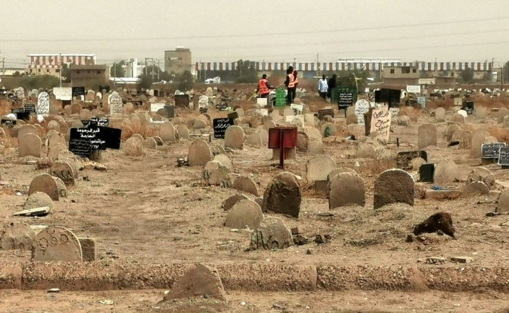 A picture taken on June 13, 2020, shows members of a forensic team at a cemetery where a mass grave of conscripts killed in 1998 was discovered, in the Sahafa neighbourhood, south of the Sudanese capital Khartoum