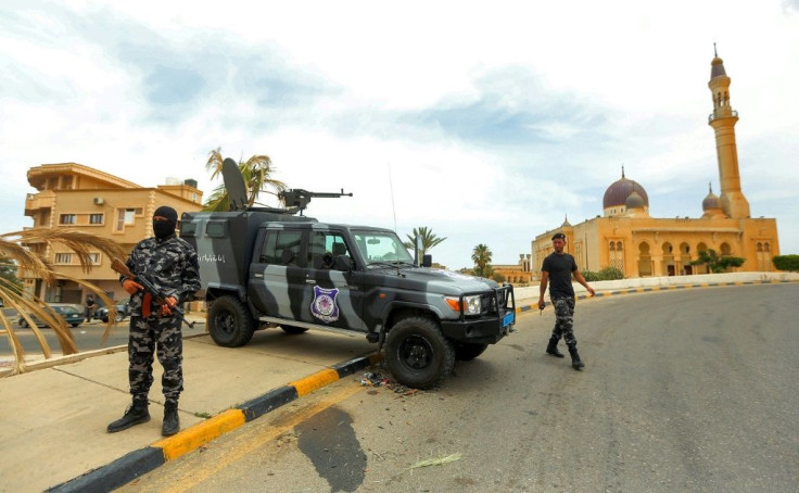 Members of security forces affiliated with the Libyan Government of National Accord (GNA) at a make-shift checkpoint in the town of Tarhuna, about 65 kilometres southeast of the capital Tripoli on June 11
