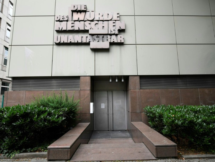 The words 'Human dignity is inviolable' stand above the entrance to a court room at the Higher Regional Court in Frankfurt, where Stephan Ernst will stand trial