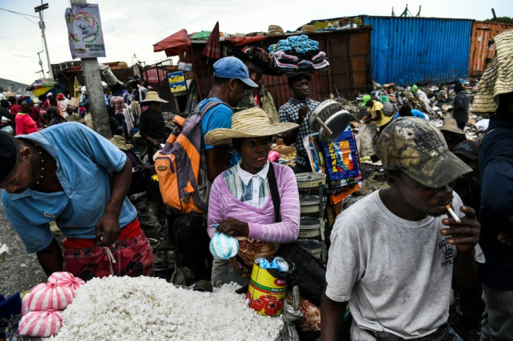 A woman (pictured July 2019) sells food items in a local market in Port-au-Prince; Haiti is a main concern for the UN's World Food Programme