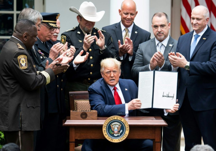US President Donald Trump signs an executive order on police reforms