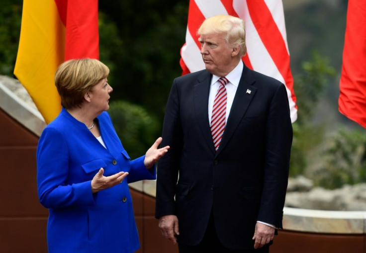 German Chancellor Angela Merkel talks with US President Donald Trump as they attend a Group of Seven summit in Taormina, Italy in May 2017