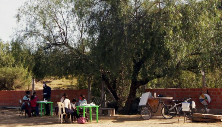 Negrete has set up socially distanced tables and chairs at his home in Aiquile to teach pupils