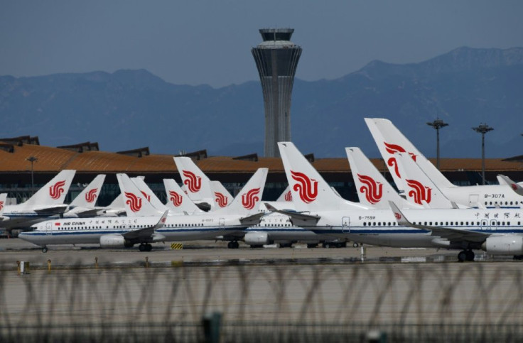 More than 1,200 flights to and from Beijing's main airports were cancelled over coronavirus worries