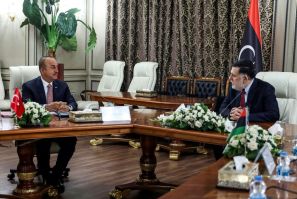 The head of Libya's UN-recognised Government of National Accord, Fayez al-Sarraj (R), met with top Turkish diplomat Mevlut Cavusoglu at the GNA headquarters in the capital Tripoli