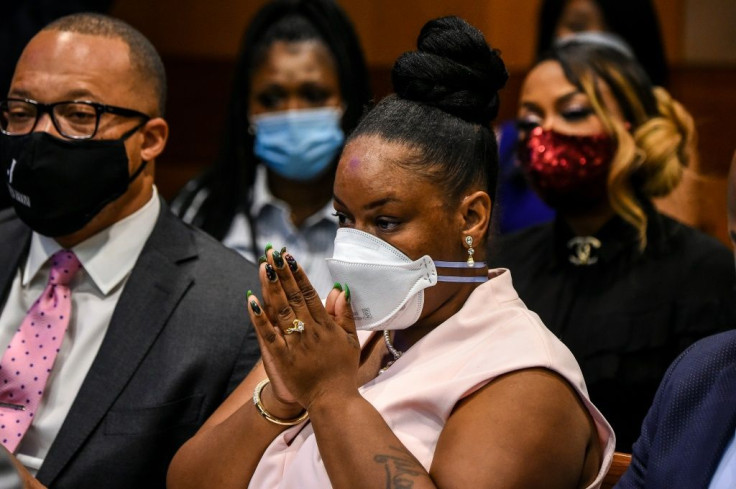 The widow of Rayshard Brooks, Tomika Miller, listens in an Atlanta courtroom as Fulton County District Attorney Paul Howard announces charges against the policeman who killed her husband.