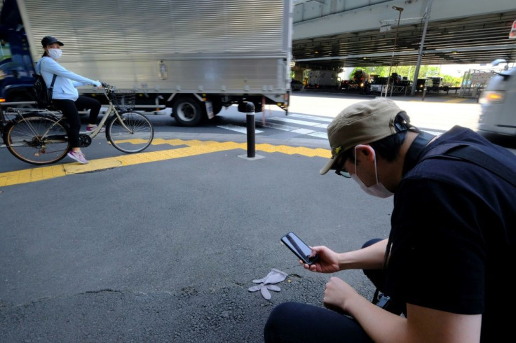 Koji Ishii can't help himself: whenever he sees a lost glove on the streets of his hometown Tokyo, he just has to stop and document it