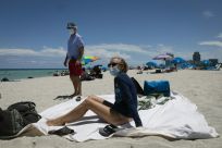 This Texas couple wore face masks while sunbathing in Miami Beach