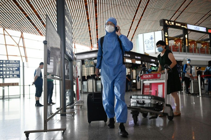 Beijing's airports have cancelled hundreds of flights over the latest cluster