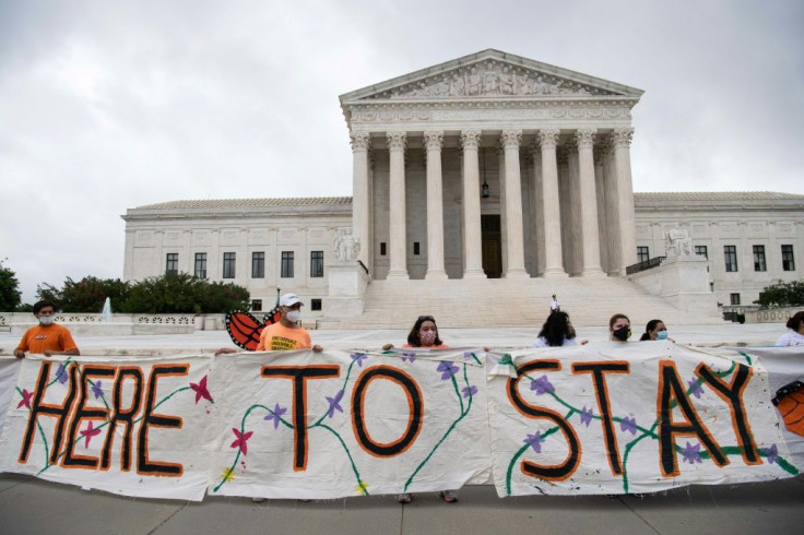 Pro-immigration activists in front of the US Supreme Court after the court upheld the DACA "Dreamers" program offering legal protections to some 700,000 people brought into the country illegally as children