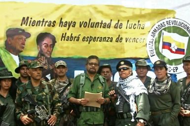 FARC former senior commander Ivan Marquez (center) and fugitive rebel colleague Jesus Santrich(wearing sunglasses) announce a return to arms in an August 2019 YouTube video