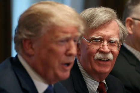 John Bolton, then national security advisor, listens to US President Donald Trump in an April 2018 meeting in the Cabinet Room