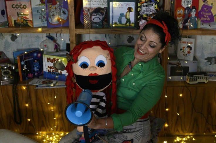 Argentine artist Any Gonzalez performs with her puppet 'Lupe' at her home in Buenos  Aires for an online children's birthday party
