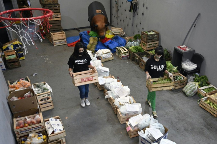 Employees of children's party venue 'Nicansio Eventos' prepare fruit and vegetable orders for delivery after the venue was forced to convert itself into a greengrocers