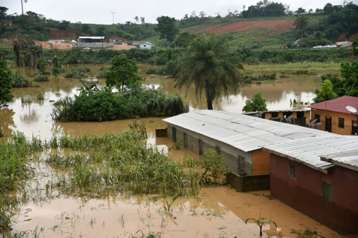 A picture shows flooded houses near the site of a landslide that killed at least 13 people in Anyama, near Abidjan.