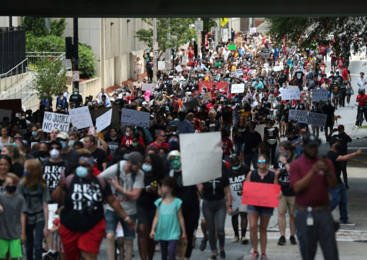 People march to the Georgia State Capitol during aÂ Juneteenth event in Atlanta