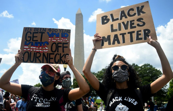 Demonstrators take part in a Juneteenth march and rally in Washington
