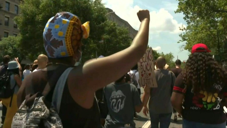 IMAGES AND SOUNDBITESHundreds of protesters take part in a silent march from the New York neighbourhood of Harlem to Seneca Village in Central Park to commemorate Juneteenth, marking the end of slavery in the United States. Seneca Village was a predominan