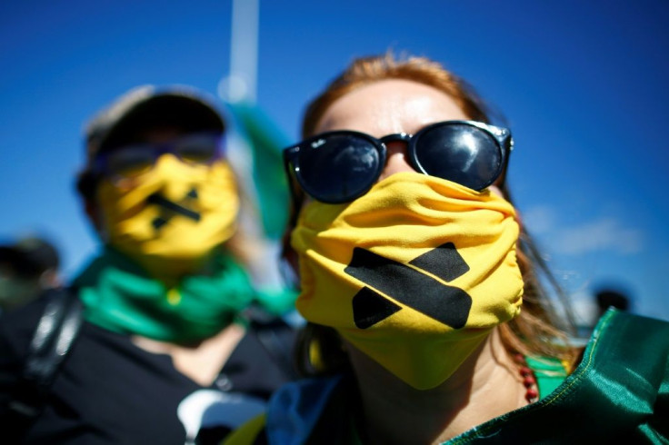 Supporters of Brazilian President Jair Bolsonaro protest on June 14, 2020 outside army headquarters against a decision by Brasilia's Governor Ibaneis Rocha preventing crowds from attending rallies