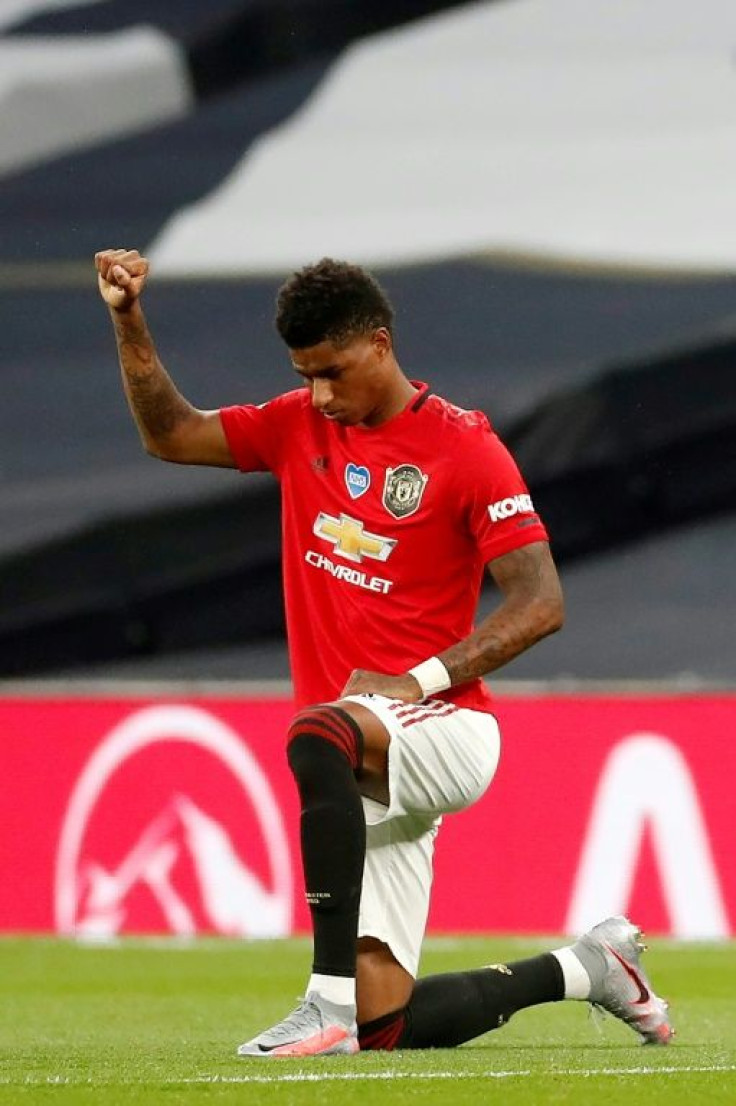 Marcus Rashford takes a knee before kick-off