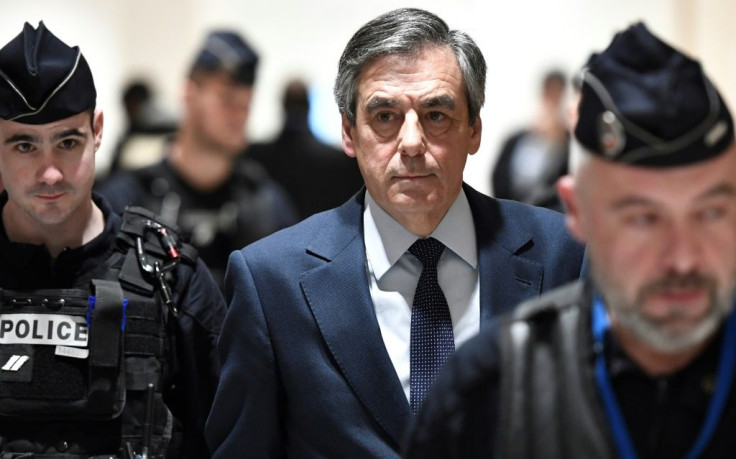 President Emmanuel Macron has called for a probe into claims prosecutors were pressured to speed up the fraud inquiry into Francois Fillon (centre), his rival and then favourite for the 2017 French presidential election